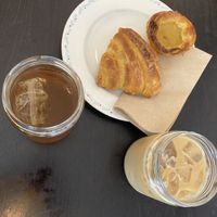 Croissant, pastel de nata, iced coffee and ice tea   at Odete Bakery in Porto