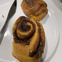 Cinnamon roll and pain au chocolat  at Odete Bakery in Porto