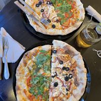 Splitted pizzas  at Odete Bakery in Porto