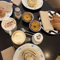 Cinnamon rolls, pastel de nata, coffees, croissants  at Odete Bakery in Porto
