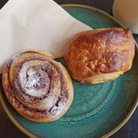Cinnamon roll and pain au chocolat at Odete Bakery in Porto