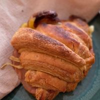 Warm croissant with cheese and ham at Odete Bakery in Porto