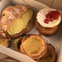 Various pastry including berlin croissant and pastel de nata  at Odete Bakery in Porto