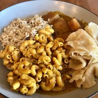 Pumpkin curry, Mac n cheese, roti, rice and peas  at Desmond's Island Soul Grill in Virginia Beach