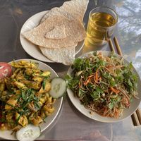 Seitan (mock meat), shallots and tumeric stir fry with rice crackers. at Huong Tu Bi in Hoi An