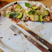 The vegan pizza fits the whole plate but I ate a lot of it already at Pizzeria Napoli in Puerto Natales