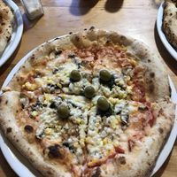 vegan pizza with green olives, mushroom, sweetcorn and garlic  at Pizzeria Napoli in Puerto Natales