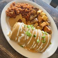 Breakfast burrito smothered in queso  at The Fix in Kansas City