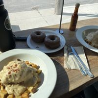 Smothered chikn biscuit and chocolate donuts 🍩   at The Fix in Kansas City
