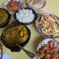 curried cauliflower with rice, fried potatoes, salad and bread  at Wannas Art Cafe in Luxor