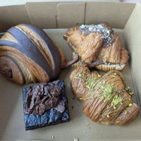 Chocolatine (top left), hazelnut croissant (top right), brownie (bottom left) and pistachio croissant (bottom right) at W.H.I.P Patisserie in Inglewood