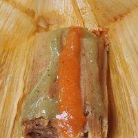 Tamale with delicious sauces at Tamales Plus in Holland