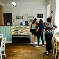 Counter full of amazing vegan pastries where you order inside Vux at Cafe Vux in Berlin
