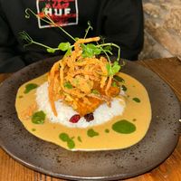 Sweet chilli, maple and lime glazed tofu, coconut & fruit rice, curry sauce & bhaji  at Nant Y Felin in Denbigh