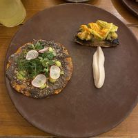 Mini tlayuda with a tortilla de chile costeño, beans, guacachile, nuts, radishes, greens; a portobello mushroom topped with calabaza/flor served with a cauliflower purée   at Teocintle - Tika'aya in Oaxaca