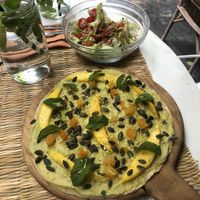 Pizetta topped with guacamole & mango  at La Famille in Marrakech
