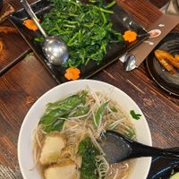 Snow pea tips (vegetable dish), and noodle soup at Huong Sen Lotus Vegetarian in Houston