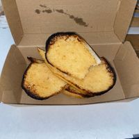 Cheesy garlic bread, had to take a bite first  at Silvio's Italian in Coffs Harbour