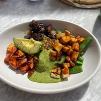 Ancient Grains Bowl (grains mix of rice and quinoa, avocado, teriyaki glazed sweet potato, snap peas, charred bok choy, and a spicy green sauce. I added the tofu!)  at True Food Kitchen in Oakbrook