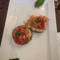 Vegan crostini, and hummus and pumpkin pizzas both made vegan. at La Masa Pizzería Conceptual in San Juan