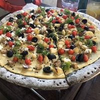 Hummus pizza with black sesame crust  at La Masa Pizzería Conceptual in San Juan