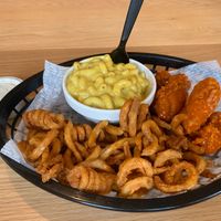Buffalo wings with curly fries and mac and cheese  at Korny Vibes in Houston