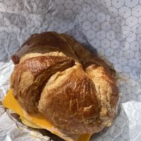 Breakfast croissant with just egg, breakfast sausage, vegan bacon and cheese   at Korny Vibes in Houston