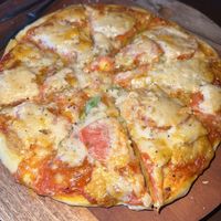 Vegan pizza with cashew cheese  at Segara Lestari in Tejakula