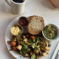 High line hash with sourdough toast and a side of smashed avocado with an Americano   at Moose Coffee in Leeds