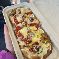 Vegan flatbread $15. I didn’t see another vegan option, but this was good. If I had to guess, they use Daiya. Very filling.   at MIA - Estefan Kitchen - N Terminal in Miami