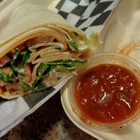 Mexicali Wrap. Chick'n tenders tossed in salsa, lettuce, tomato, vegan ranch, and cheddar cheese wrapped in a tortilla. Served with salsa on the side.  at Birch Cafe in Highland Heights