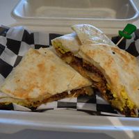 Corn’d beef hash breakfast crunchwrap special. Sautéed Corn'd beef and onions, a hash brown patty, tofu eggs, and melted provolone. Add a side of thousand island for a small upcharge. Vegan. at Birch Cafe in Highland Heights