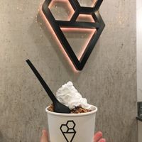 2 scoop sundae with coconut whipped cream at Dandy's Artisan Ice Cream in Regina