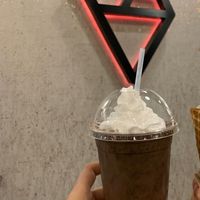 Seasonal nanaimo bar mylkshake with raspberry sauce (checked the ingredients- it’s vegan) and coconut whipped cream at Dandy's Artisan Ice Cream in Regina