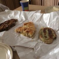 Three vegan pitas. L to R Buckwheat flour with mushroom, potato and Spinach and leek. at Kljuch Bakery in Belgrade