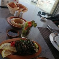 Humus and stuffed vine leaves  at Sidra By The Citadel in Alexandria