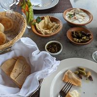 Hummus with pine nuts and tahini. Mango kiwi juice. Note: round puffy breads contain milk. at Sidra By The Citadel in Alexandria