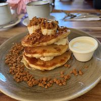 Triple Stacked Pancakes - Banana Biscoff, whipped vanilla yogurt and caramel drizzlee   at The Veg Box Cafe - Canterbury in Canterbury
