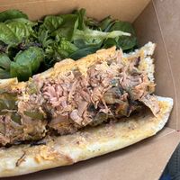 Delicious jackfruit cheesesteak- blew my mind it is soooo goood and the fresh salad completes it   at Naked Lunch in Philadelphia