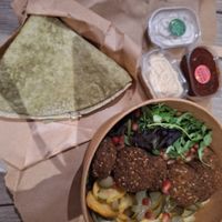 Falafel bowl with sauces and pita at Efendi Doner in Bucharest