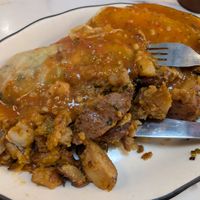 Stuffed cabbage (with rice, peppers, mushrooms and cilantro) with fried potatoes and tomato sauce at B and H Dairy Vegetarian Restaurant in New York City