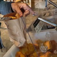 Filling paper bag with product at Salud a Granel in Tijuana