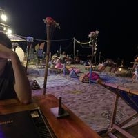 Outdoor beach seating at Blue Moon Bar in Koh Lanta