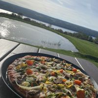 Veg out pizza with vegan cheese at Grist Iron Brewing Company in Burdett