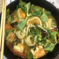 Vegan ramen bowl. They automatically replace the ramen noodles with udon. The broth is curry-based. Very tasty!!  at MXP - Wagamama - T1 in Ferno