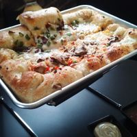 Pizza: half veggie deluxe, half jalapeno. at 4th & State in Columbus