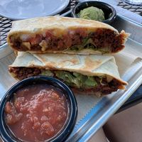 Crunch wrap with a side of salsa and guacamole   at 4th & State in Columbus