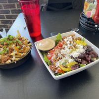 Greek salad (Caesar dressing) & loaded fries  at 4th & State in Columbus
