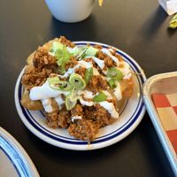 Chorizo, sour cream, queso loaded hashbrowns  at 4th & State in Columbus
