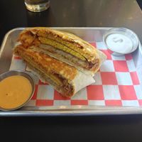 Vrunchwrap (chorizo, egg, hashbrown) with side of sour cream at 4th & State in Columbus